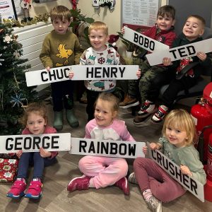 Children holding BSH Recycling registration plates